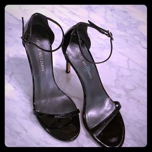 Stuart Weitzman black patent leather heels.